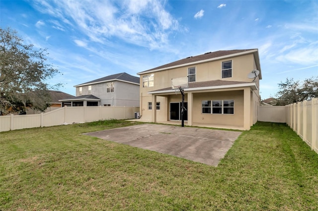 rear view of house featuring stucco siding, a lawn, a patio area, cooling unit, and a fenced backyard