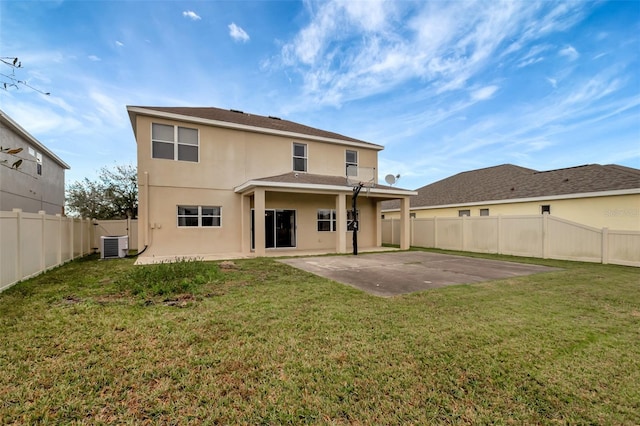 back of property with a fenced backyard, cooling unit, a yard, a patio area, and stucco siding