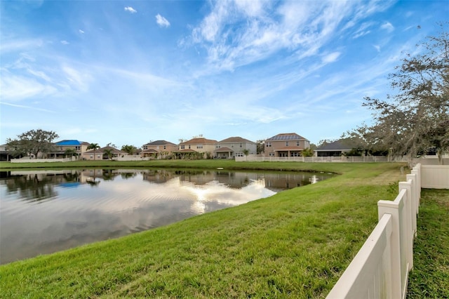 property view of water featuring fence