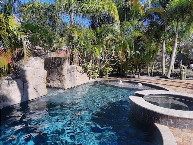 outdoor pool with an in ground hot tub