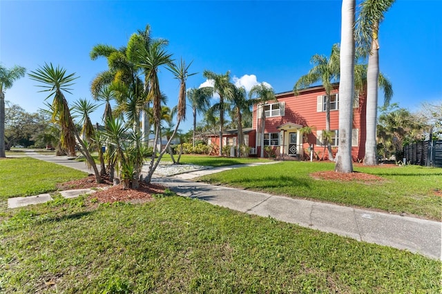 view of front of home with a front lawn