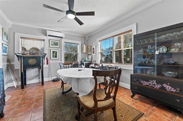 dining room featuring a textured ceiling, crown molding, and a wall unit AC