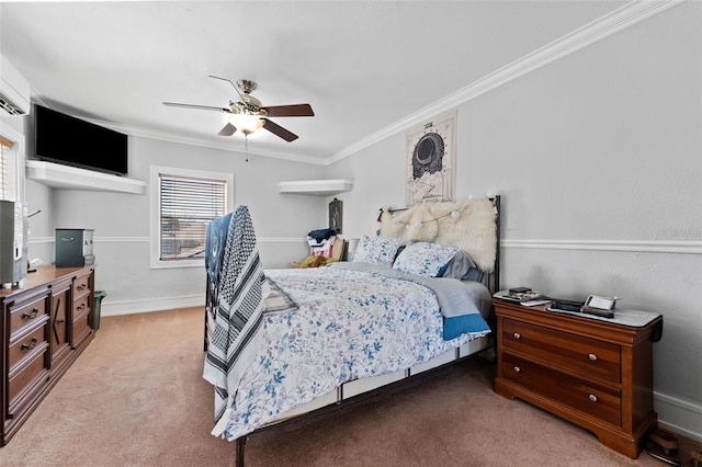 bedroom featuring crown molding, baseboards, carpet floors, and ceiling fan