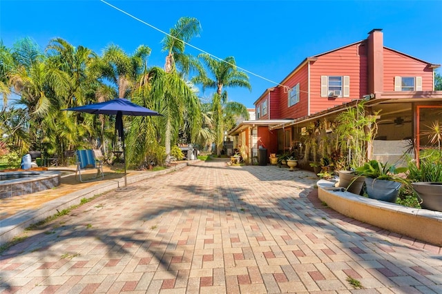 exterior space with a ceiling fan