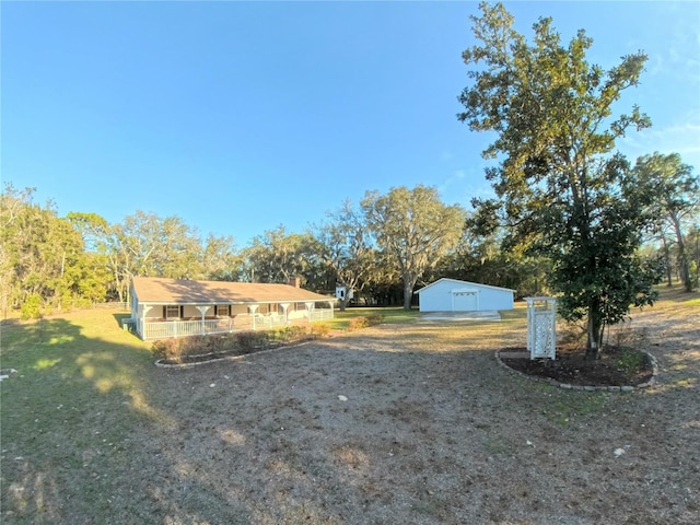 view of front of property with an outbuilding and a front lawn