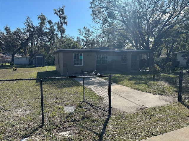 view of front of property with a front yard and fence