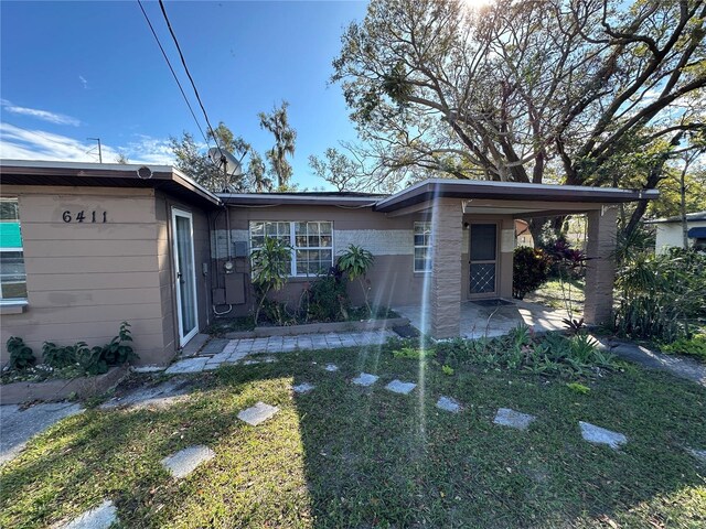 view of property exterior featuring a yard