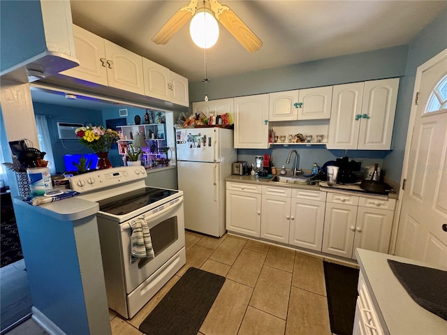 kitchen with light countertops, white cabinets, a sink, ceiling fan, and white appliances