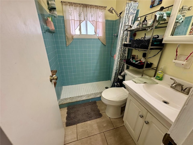 full bathroom with a stall shower, tile patterned flooring, vanity, and toilet