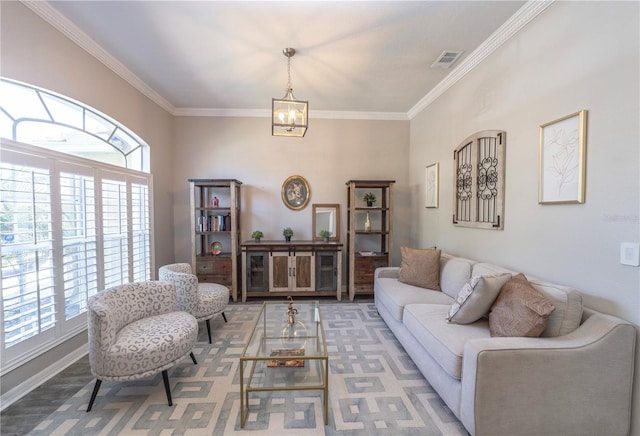 living room featuring crown molding, a notable chandelier, visible vents, carpet flooring, and baseboards