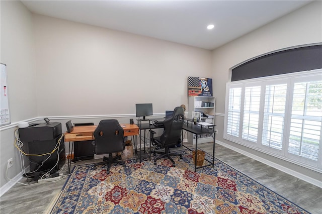 office space featuring baseboards, wood finished floors, and recessed lighting