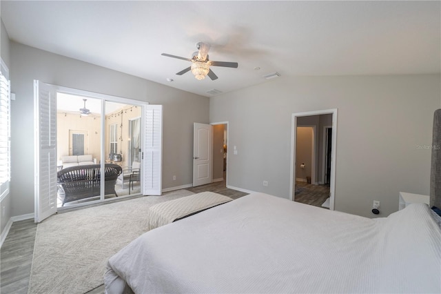 carpeted bedroom featuring access to exterior, visible vents, vaulted ceiling, ceiling fan, and baseboards