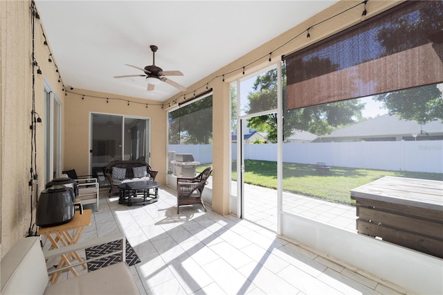 sunroom with a ceiling fan