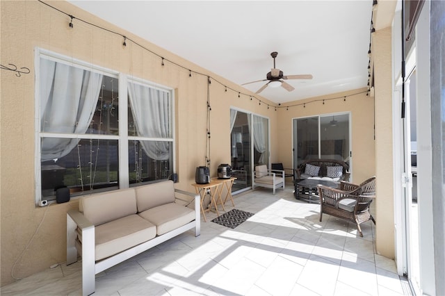 exterior space with ceiling fan and an outdoor hangout area