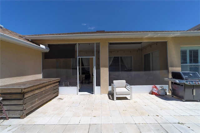 view of patio featuring a grill