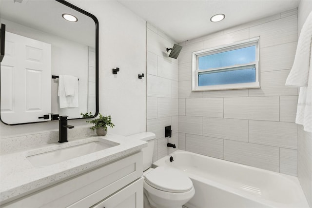 bathroom featuring toilet, recessed lighting,  shower combination, and vanity