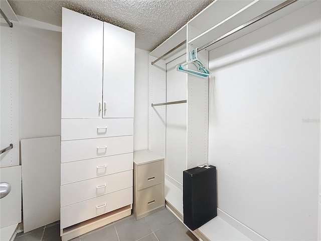 walk in closet featuring light tile patterned floors