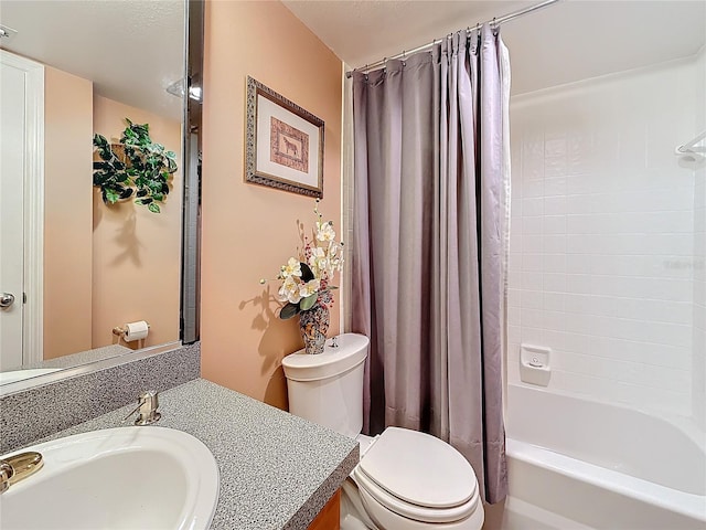 bathroom featuring shower / tub combo with curtain, vanity, and toilet