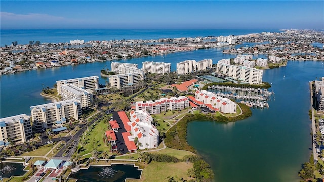 birds eye view of property featuring a water view and a city view