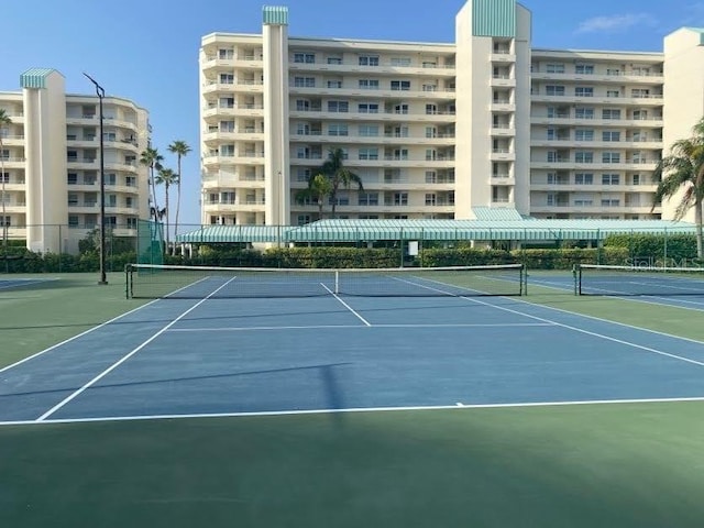 view of sport court featuring fence