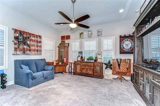 sitting room with ceiling fan, baseboards, and carpet flooring