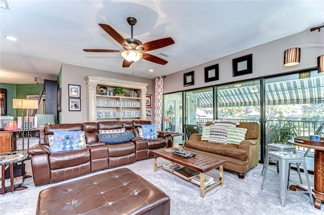 living room with carpet floors, recessed lighting, visible vents, and a ceiling fan