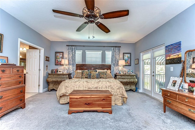 carpeted bedroom featuring access to exterior, french doors, baseboards, and a ceiling fan