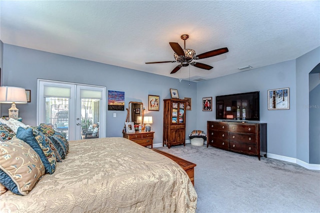 carpeted bedroom with visible vents, baseboards, access to exterior, a textured ceiling, and french doors