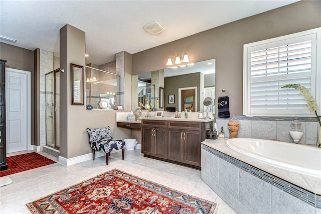 full bath with a garden tub, vanity, baseboards, a shower stall, and tile patterned floors