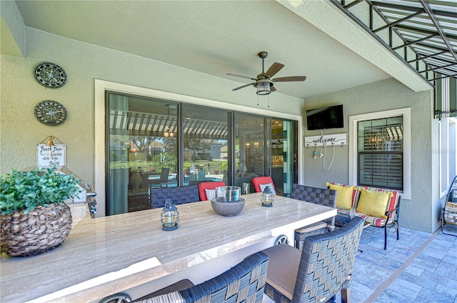 view of patio / terrace featuring ceiling fan