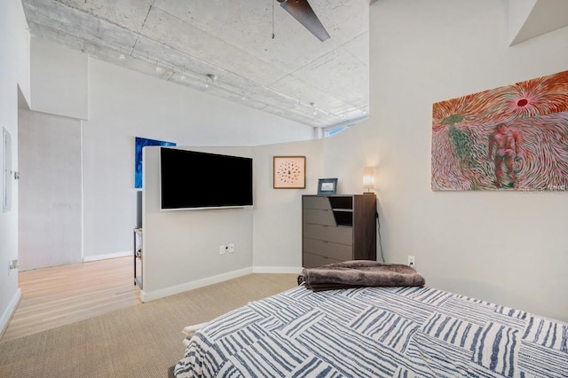 bedroom with carpet floors, baseboards, and a ceiling fan