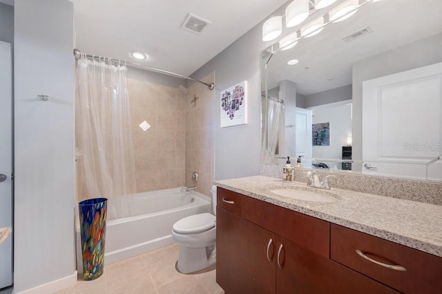 full bathroom featuring tile patterned flooring, visible vents, toilet, and shower / bath combo with shower curtain