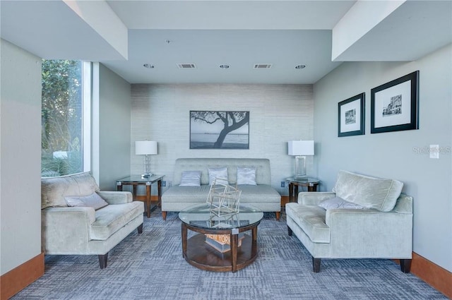 living room featuring recessed lighting and visible vents