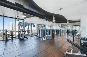 exercise room with floor to ceiling windows