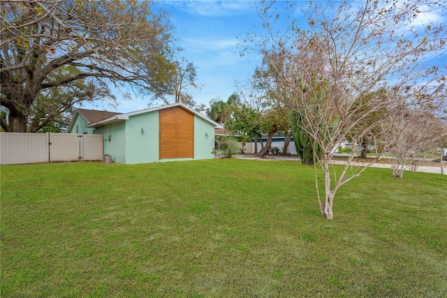 view of yard with a gate and fence