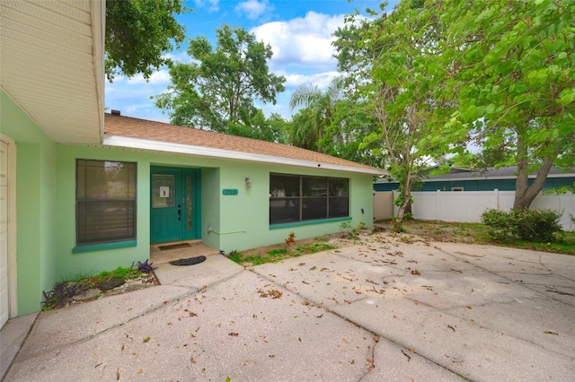 1710 Orange Hill Way, Brandon, FL 33510 - doorway to property with stucco siding and a patio area