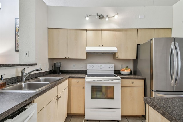 kitchen with light brown cabinetry, white appliances, a sink, and under cabinet range hood