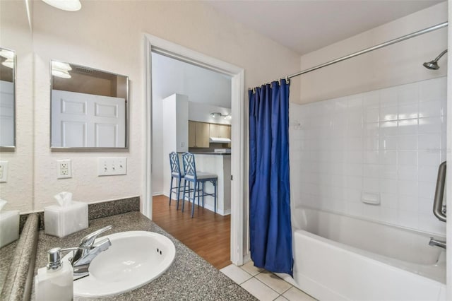 full bathroom with tile patterned flooring, shower / bath combo, and vanity