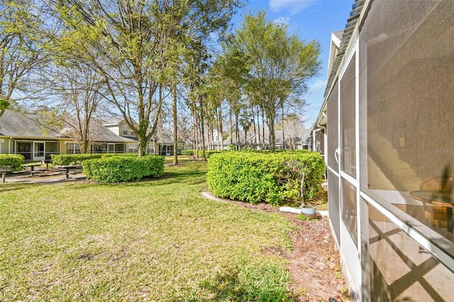 view of yard with a sunroom