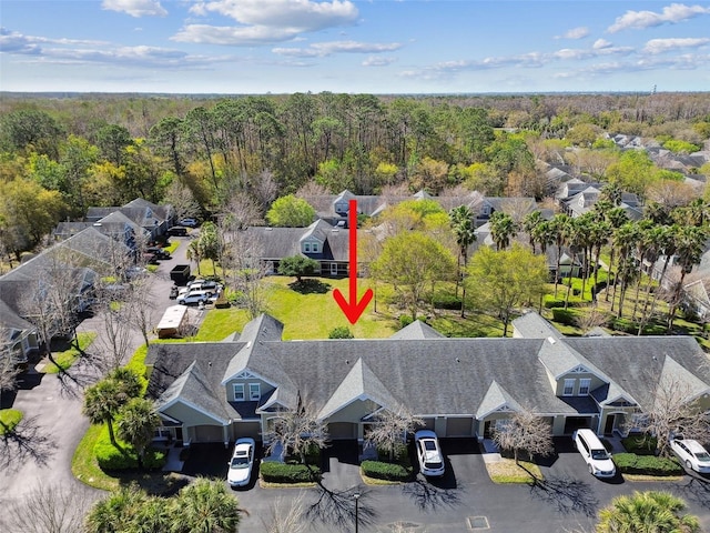 bird's eye view featuring a residential view and a view of trees