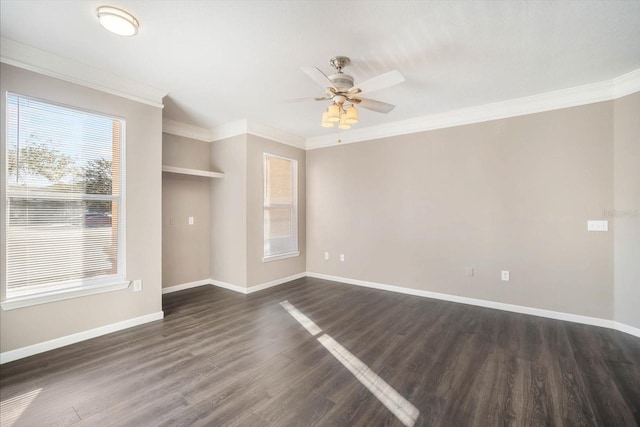 interior space featuring dark wood-type flooring, ornamental molding, baseboards, and a ceiling fan