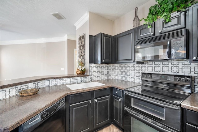 kitchen with crown molding, tasteful backsplash, visible vents, a sink, and black appliances