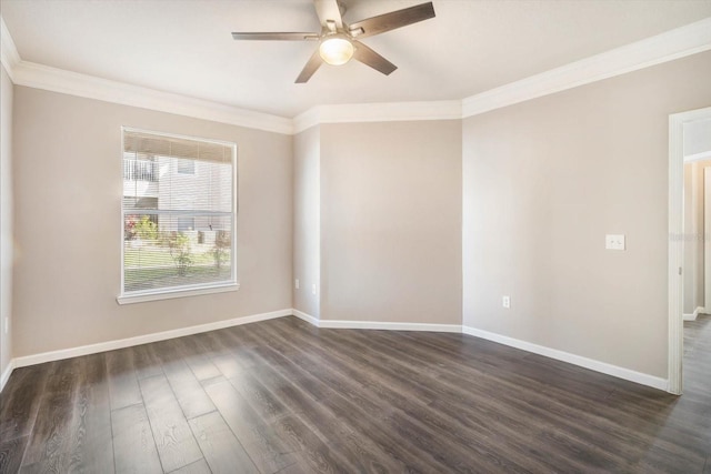 empty room featuring crown molding, dark wood finished floors, baseboards, and ceiling fan