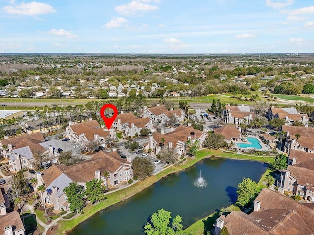 aerial view featuring a residential view and a water view