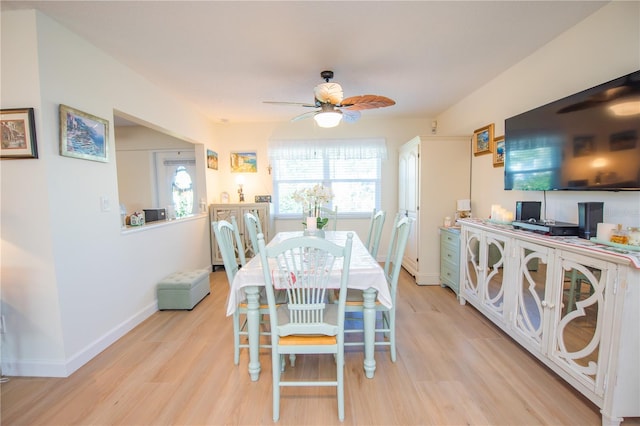 dining area with ceiling fan, light wood-style flooring, and baseboards