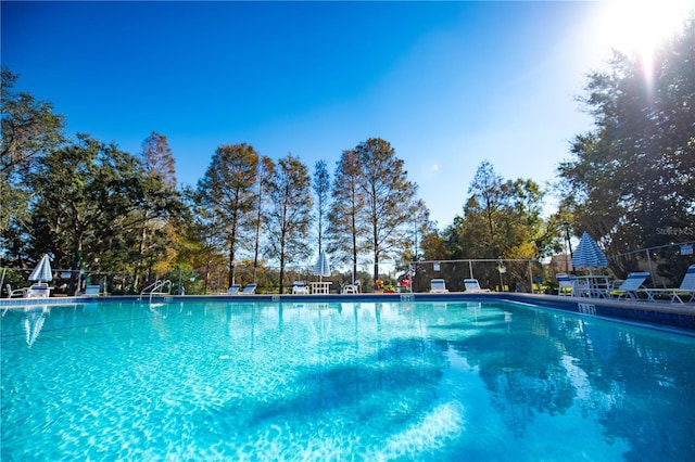 community pool featuring fence