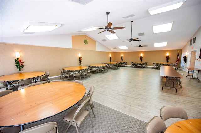 interior space featuring vaulted ceiling, visible vents, and light wood-style floors