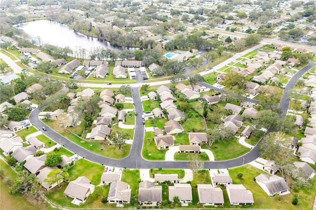 drone / aerial view featuring a water view and a residential view