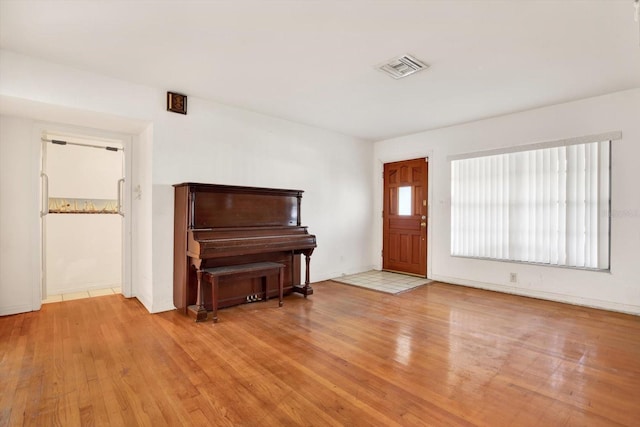 entryway with visible vents and wood finished floors