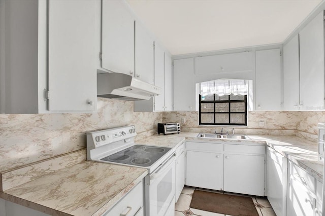 kitchen featuring white range with electric cooktop, decorative backsplash, light countertops, under cabinet range hood, and a sink